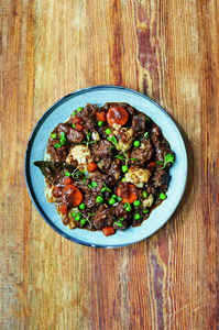 Beef stew with carrots, cauliflower, and cabbage. Photography by Luke Albert